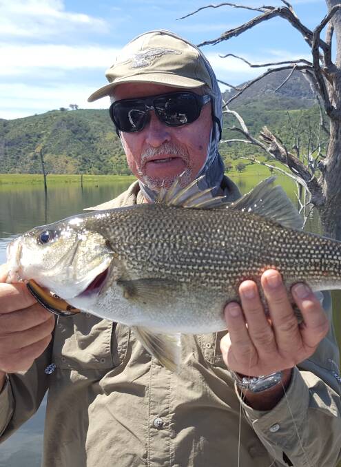 Marc Stead with a 44cm bass he caught with a handmade lure.