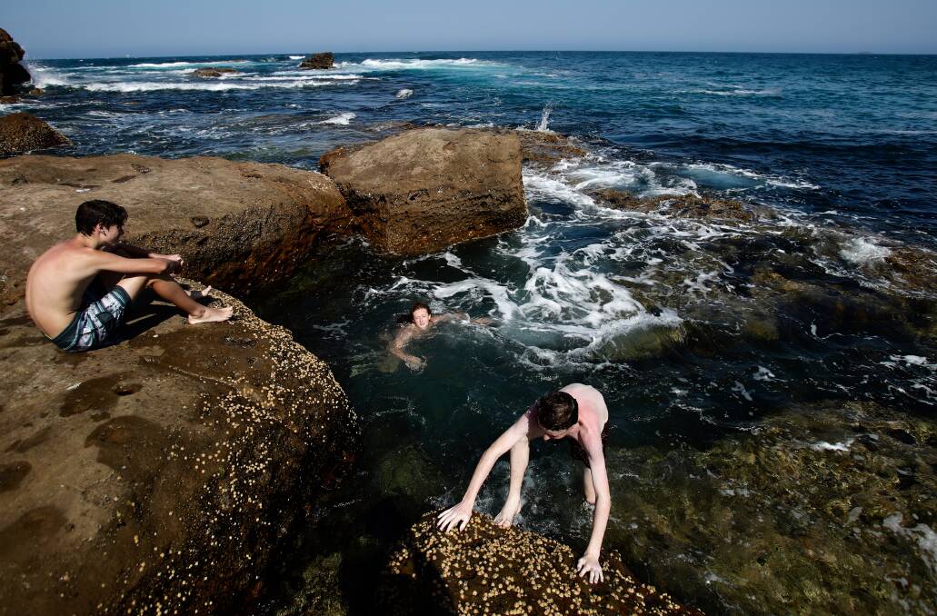 Teenagers cool off at Flagstaff Point at City Beach. Picture: Adam McLean