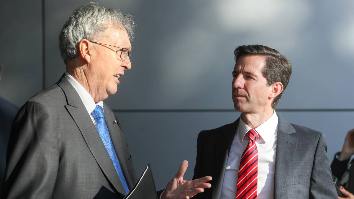 Prof Paul Wellings with Federal Minister for Education and Training Simon Birmingham in 2018. Picture: Adam McLean