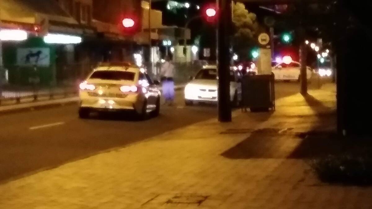 Police outside the chemist on Sunday night.