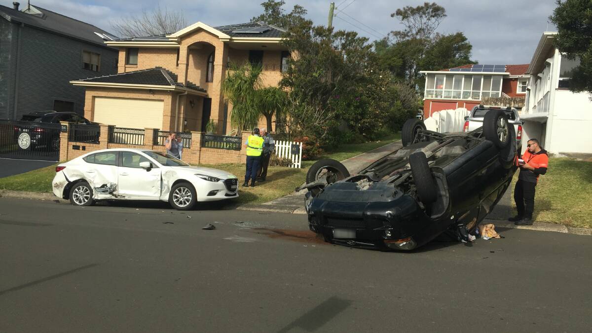 A car has flipped onto its roof after the driver hit a parked car. Picture: Robert Peet