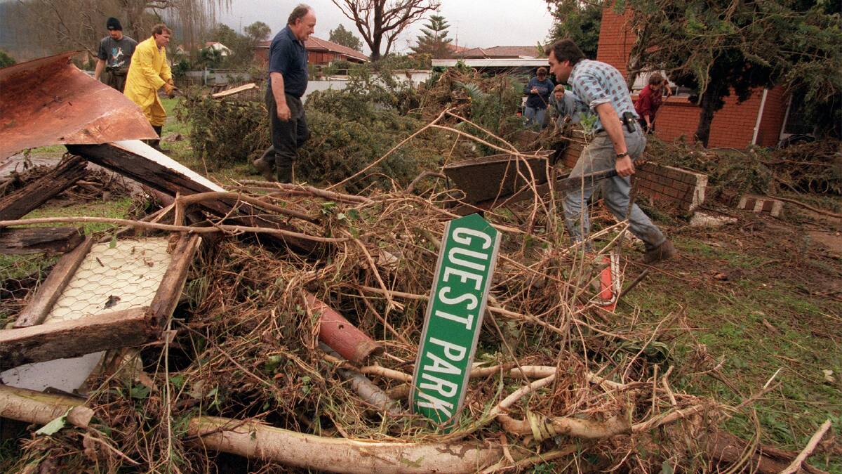 Damage done: Community rallies to clean up the damage after the 1998 floods.