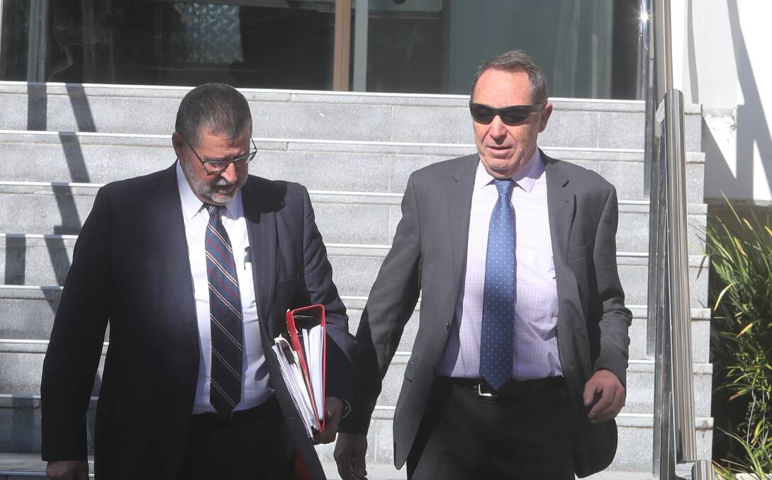 Defence lawyer Sam Macedone with Nigel Duncan (right) outside Wollongong Court in May. 