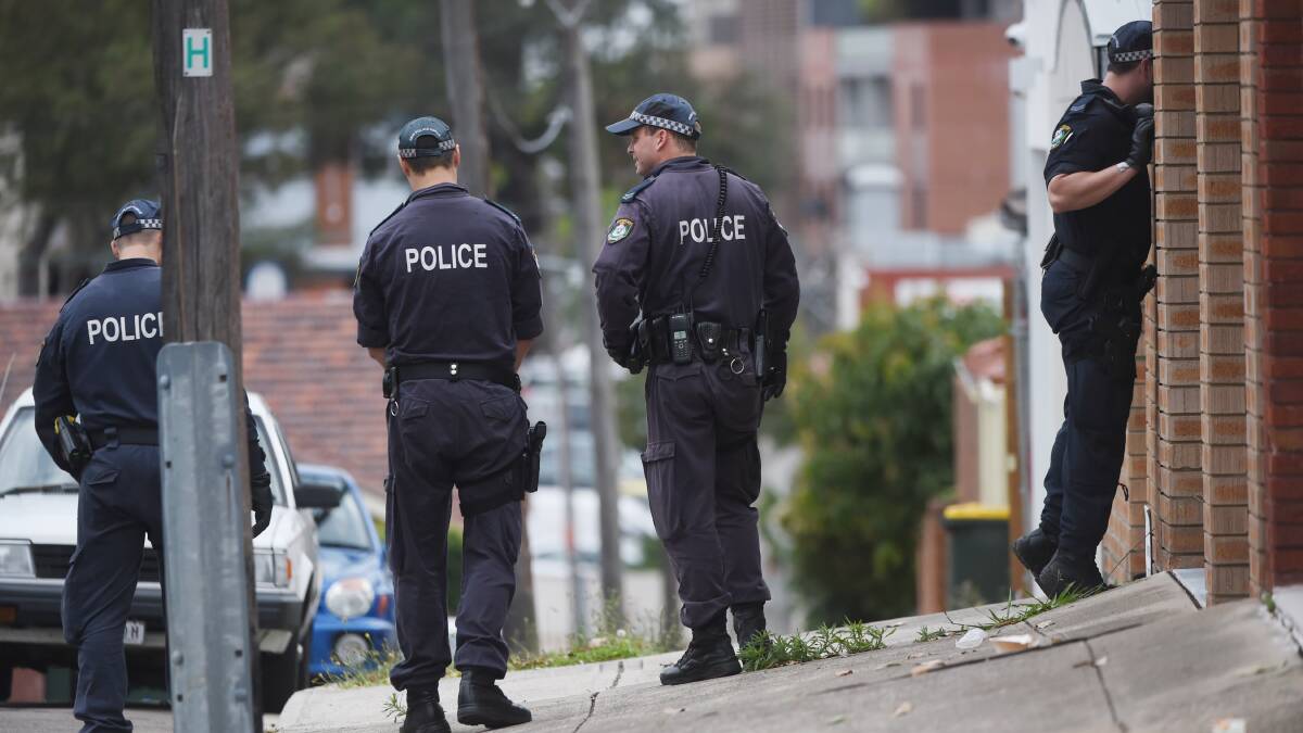 Police scour the scene in Larkhall Ave in Earlwood after Pasquale Barbaro was shot dead at the home of George Alex. Photo: Nick Moir