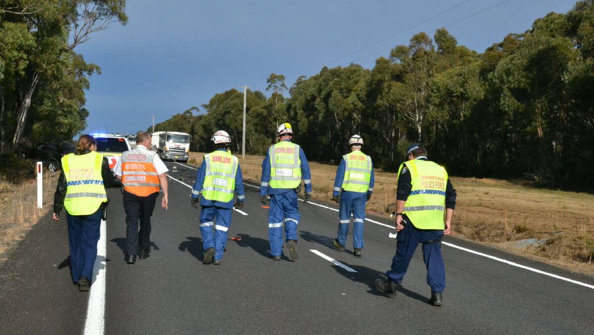 Emergency services approach the scene of a crash on Braidwood Road Monday morning. Picture: South Coast Register