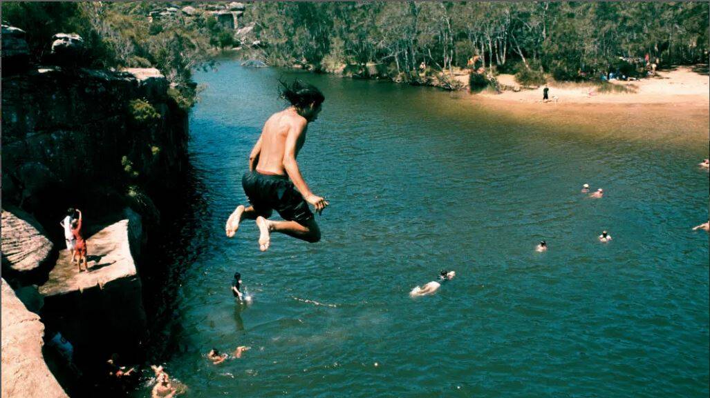 Despite the warnings, jumping off the cliffs into the lagoon remains a popular activity at Wattamolla. Picture:TAMARA DEAN