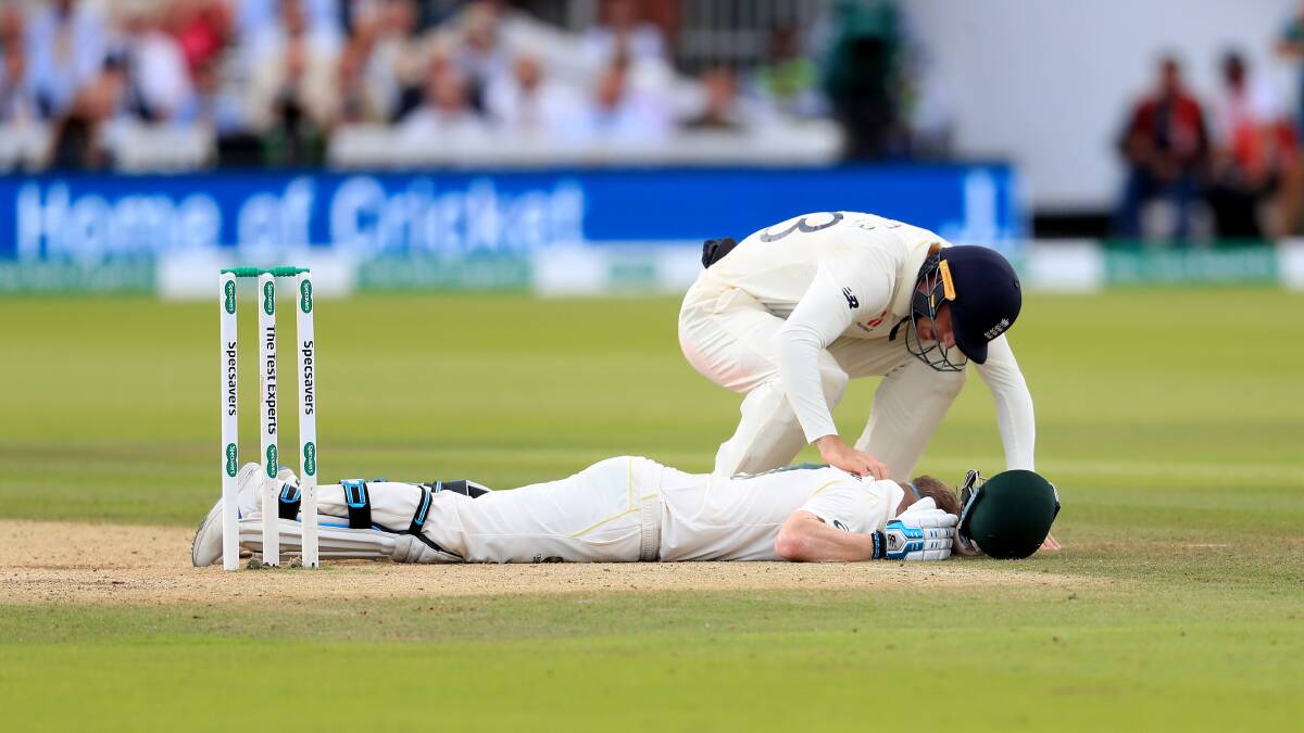 Australia's Steve Smith ends up on the floor after being hit by the ball during day four of the Ashes Test match. Picture: PA