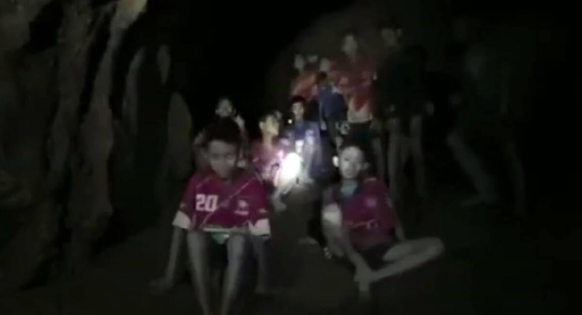 Twelve boys and their football coach have been found alive by rescuers inside a Thai cave complex nine days after they went missing. Picture: Thai Navy Seal via AP