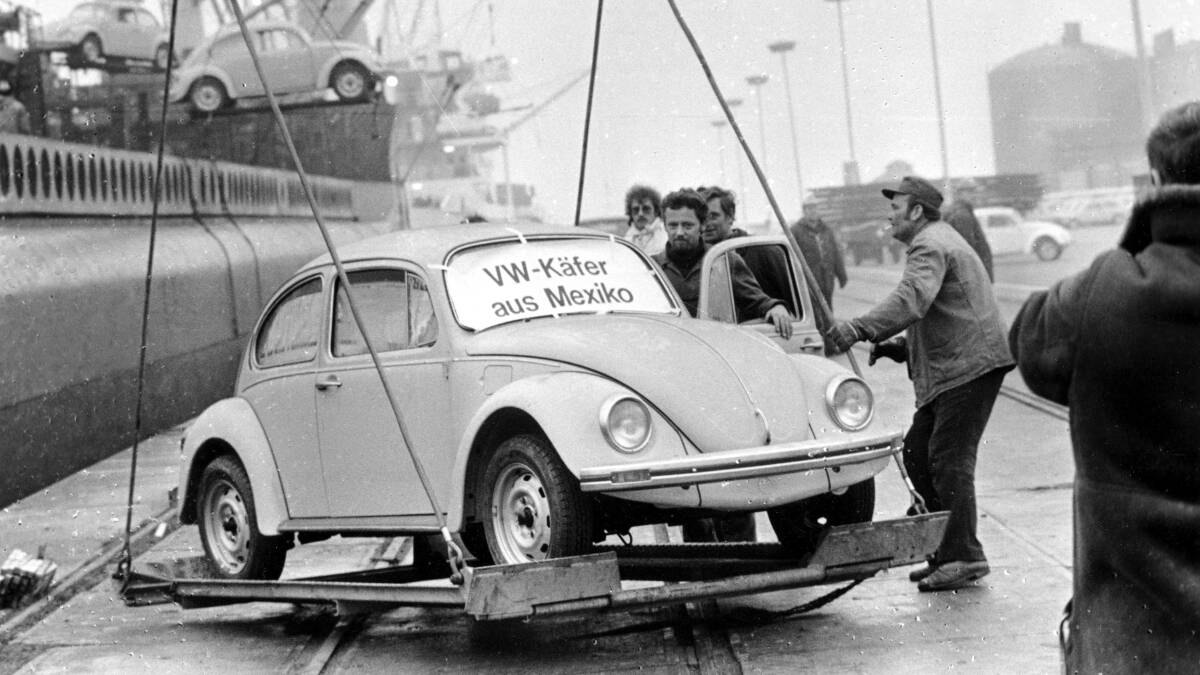 A Volkswagen Beetle is unloaded at Emden harbor, Germany, as the first shipment of 1600 Beetles made in Mexico arrives in December 1977. Picture: AP