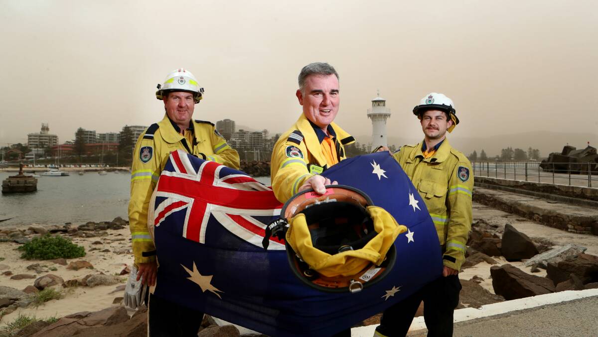 Mount Keira RFS, including Andrew O'Hanlon, Peter Parsons and Scott Robertson will be part of the parade, and will be collecting donations throughout the evening. Picture: Sylvia Liber