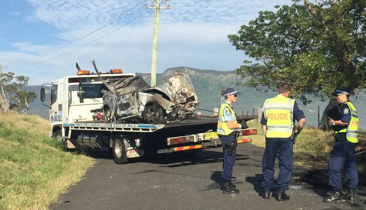 A passenger was killed after a car burst into flames at West Dapto overnight. Picture: SYLVIA LIBER