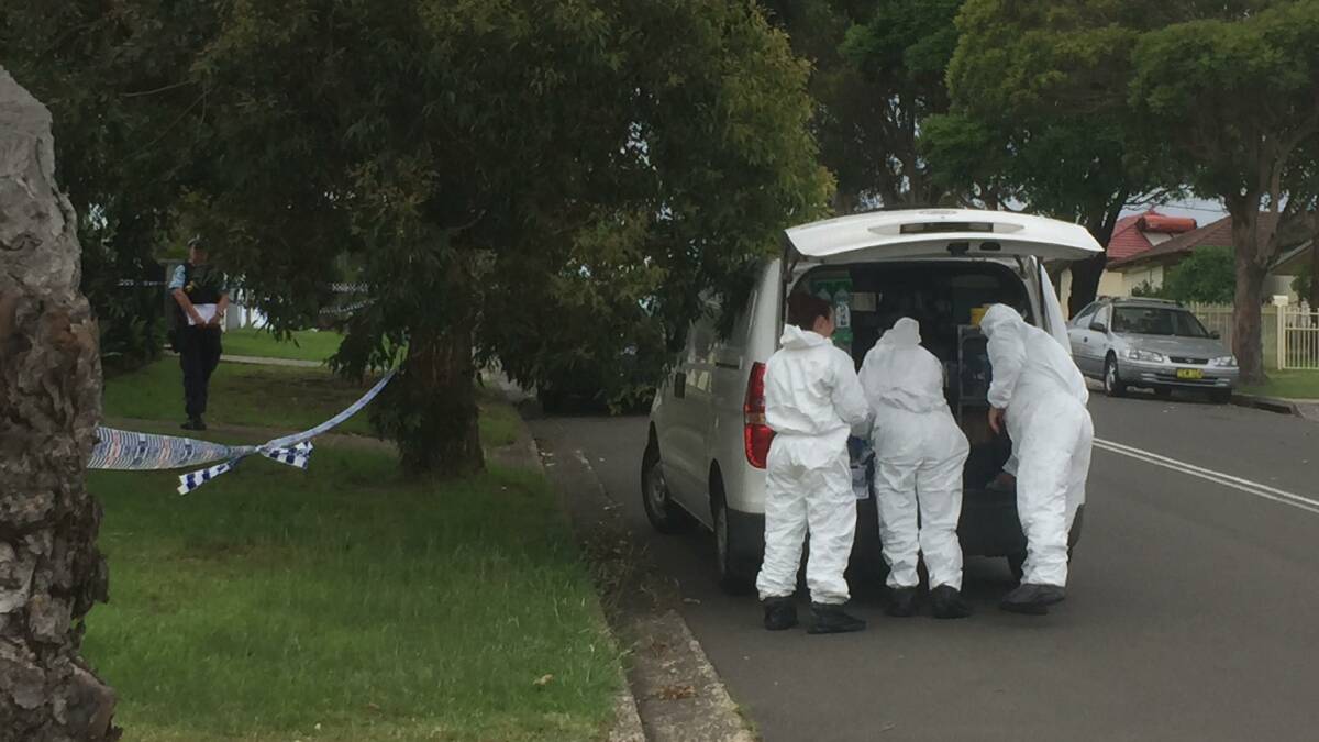 Forensic officers at the Warrila crime scene. Picture: Anna Warr