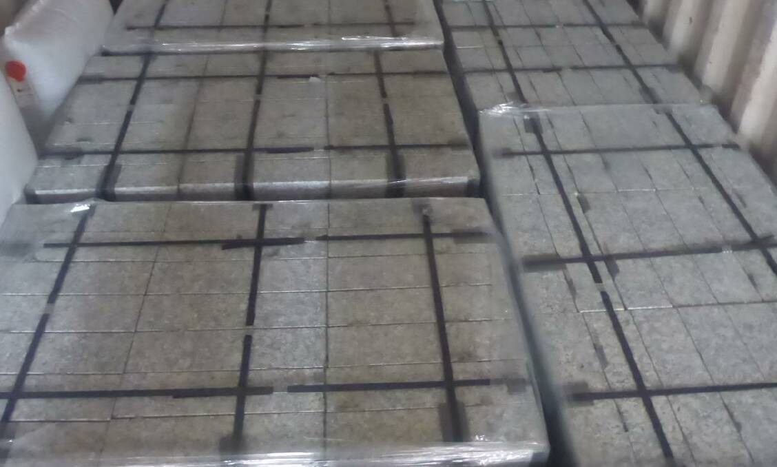 Australian Border Force officers inspected a large consignment from Spain, where they located and seized 21 kilograms of cocaine concealed in tiles. Photo: NSW Police