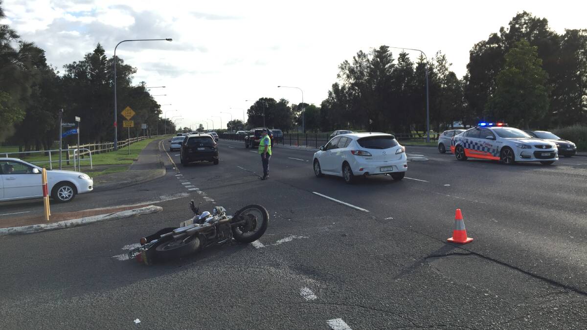 Traffic is heavy at Lake Illawarra after a motorcycle and car crash on Monday.