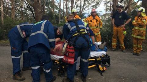 NSW Ambulance paramedics work to stabilise the injured man before he was transported to Wollongong Hospital.