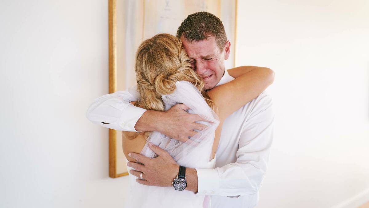 Mike Baird in tears as he sees Laura for the first time in her wedding dress. Photo: James Day Photography