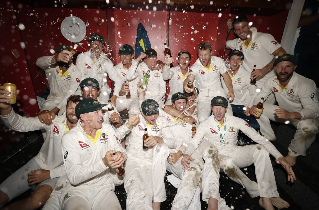 The Australian Cricket Team celebrate in the change rooms after Australia claimed victory to retain the Ashes. Picture: Getty Images