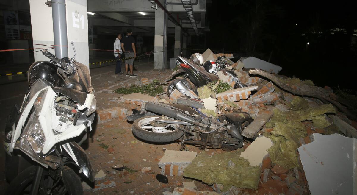 Debris on top of a motorcycles after an earthquake in Bali. Picture: AP
