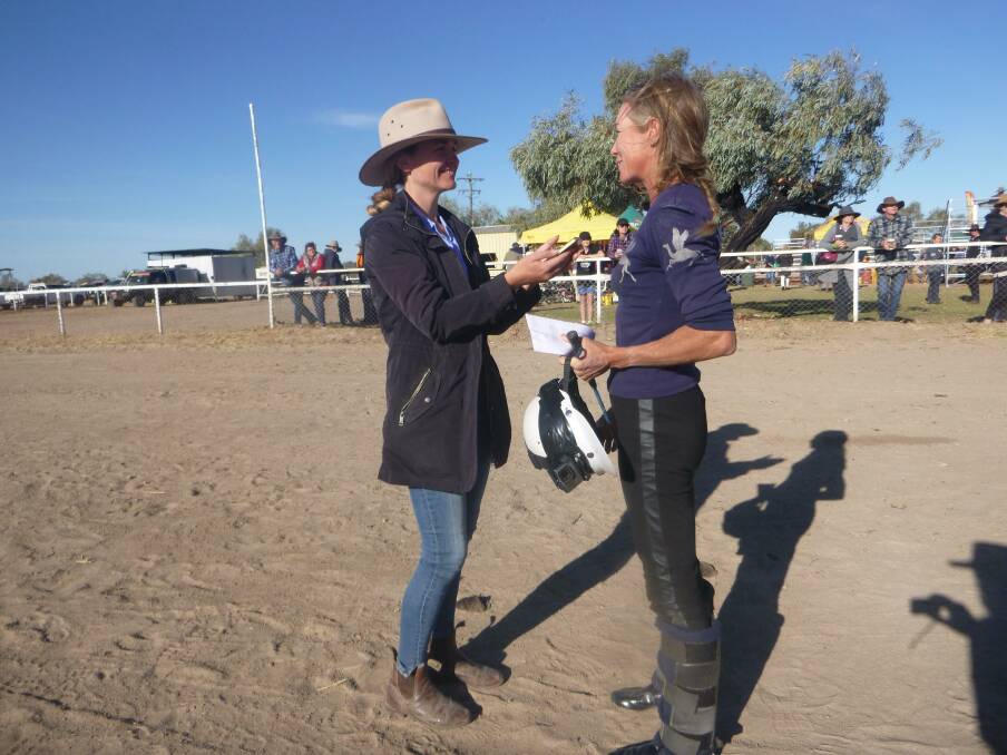 I interview Glenda Sutton after she trained and rode the winning camel in the 2019 Bedourie Cup. Photo: Geoff Cochrane.