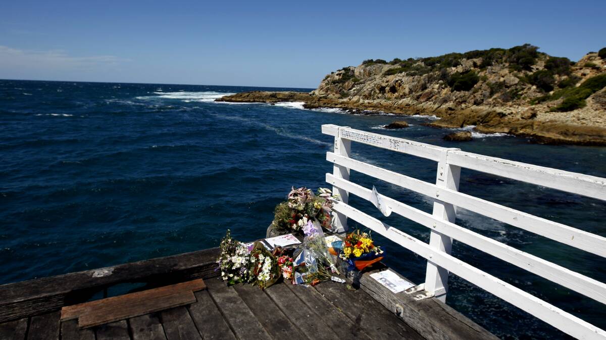 Flowers are left on the Tathra Wharf in the aftermath of the the November 18, 2008, tragedy that claimed the lives of Shane O'Neill and his two sons. Picture: Fairfax file image