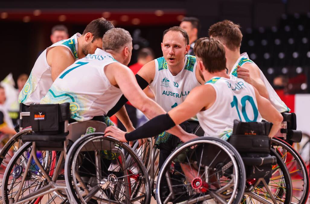 CATALYST FOR CHANGE: Australia's Paralympics wheelchair basketball team, the Rollers, prepare for their match against Germany. Photo: AAP Images