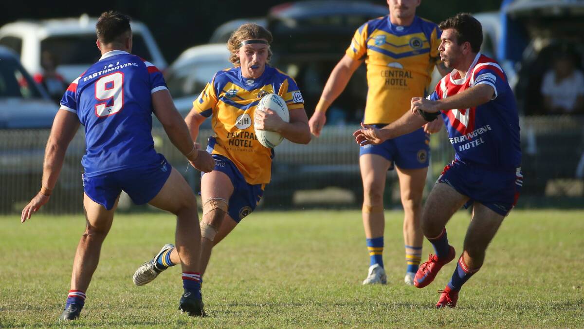 Warilla-Lake South's Lleyton Hughes tries to split Gerringong defenders Nathan Ford and Issas Russell during the side's earlier match this season. Photo: David Tease