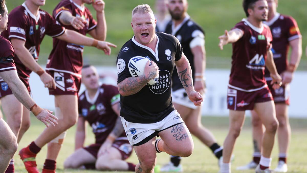 Zac Kershaw, scoring a try for the Shellharbour Sharks during the 2021 season, has been stood down by the NSWRL. Photo: Anna Warr