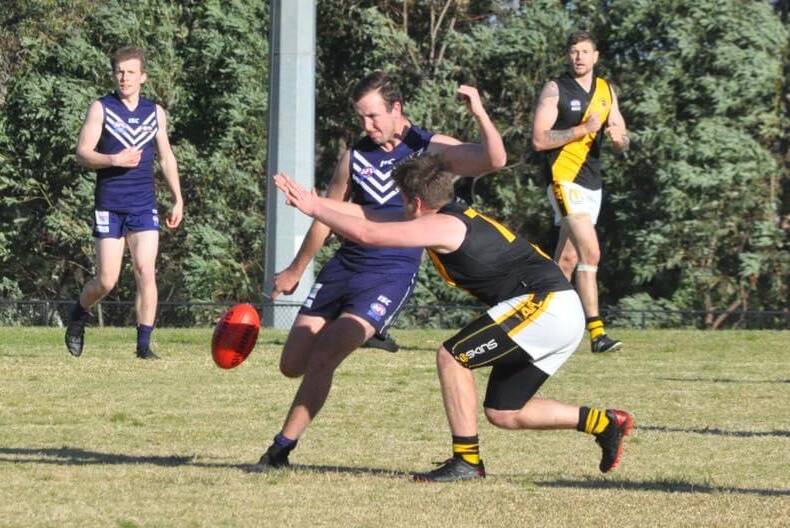 Ulladulla Dockers' Harrison Donohue sets himself for a kick against the Bomaderry Tigers this season. Photo: Kimberley Peat