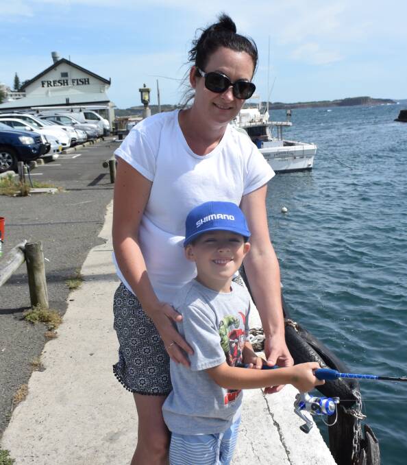 Lisa Allan and Leon Sayers fishing in the harbour for the Children's Fishing Charity Competition on January 8. Leon caught a number of fish throughout the morning. 