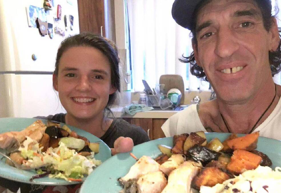 Jess McLean and her father Tim enjoy a baked dinner in Ulladulla before he travelled to Wuhan.