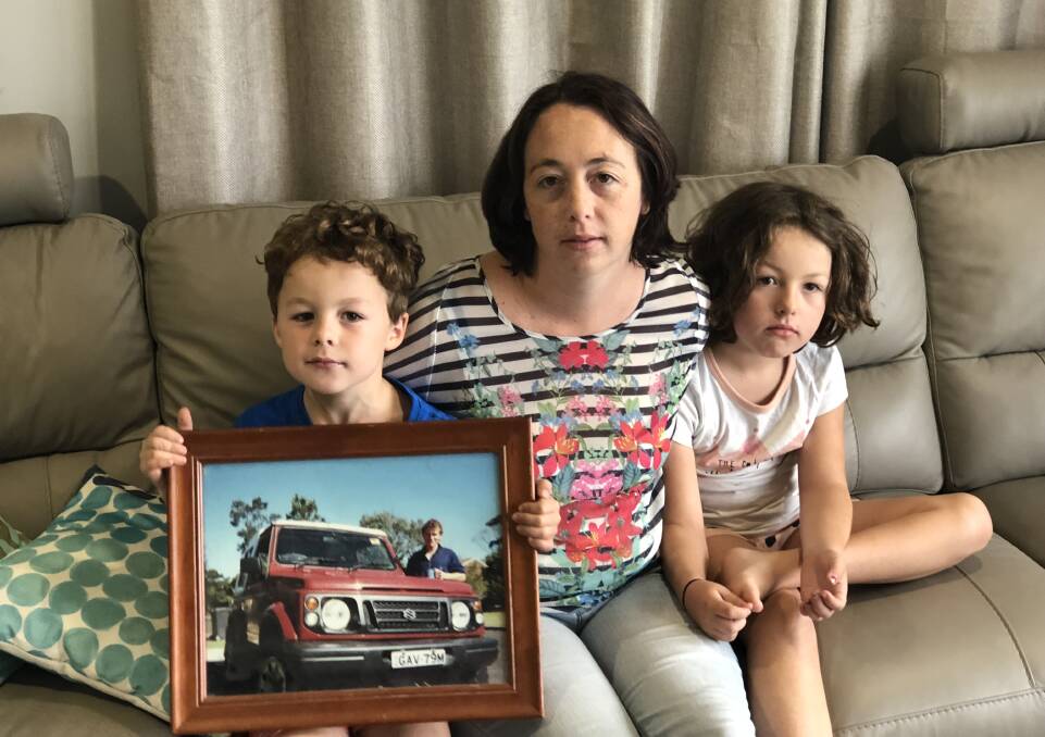 Alison Murray, 35, with Darcy, 6, and Jules, 7. Gavin Murray, in the photo, died after an accident on the Princes Highway on December 21, 2015. 