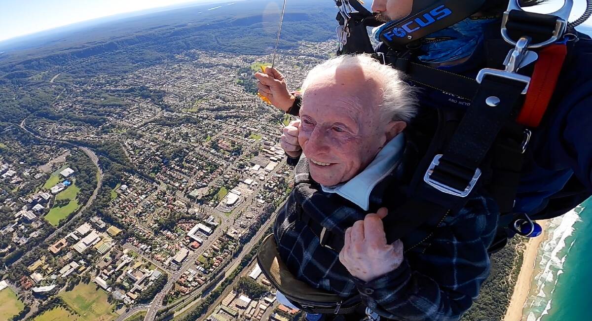 George Coghlan, 90, enjoys the view of Wollongong on his recent skydive. He says he'd do it again just to enjoy the sights. Photo: Skydive Sydney-Wollongong.