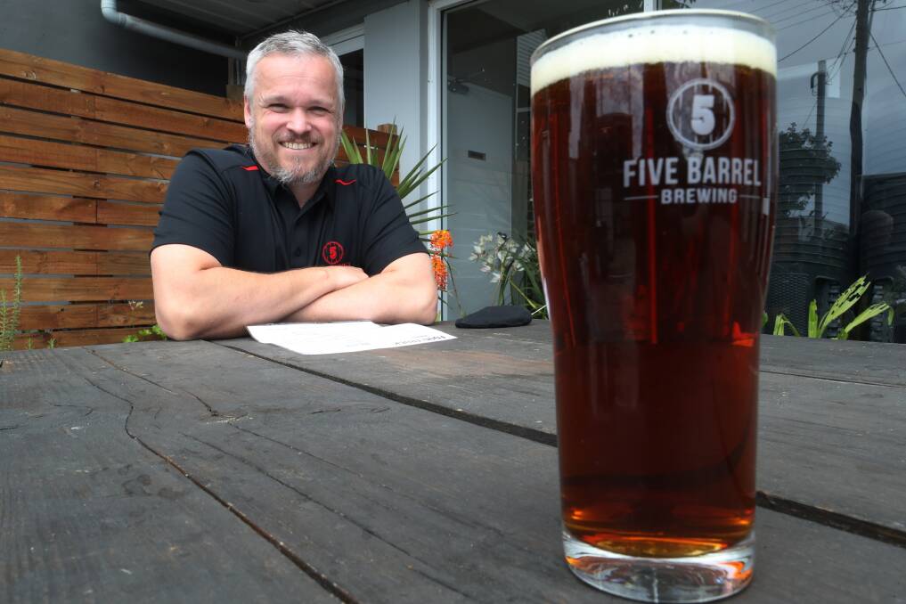 Sun: Five Barrel Brewing co-owner Tim O'Shea outside the Keira Street brewery, where they are hoping patrons will soon be able to sit and sample some beer. Picture: Robert Peet