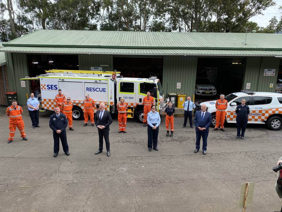 Rescue: Kiama MP Gareth Ward and Police and Emergency Services Minister David Elliott with Kiama SES crews and the new vehicles. Picture: supplied