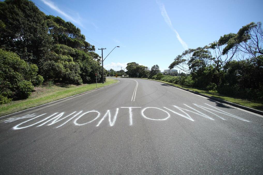 Message: Graffiti on the road to the Port Kembla Coal Terminal - the site of much industrial unrest. Picture: Adam McLean