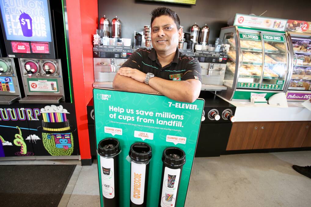 Going green: Shiv Pathak, franchisee of the 7-Eleven at Berkeley with the Closed Loop program that aims to increase the amount of coffee cups that are recycled. Picture: Adam McLean