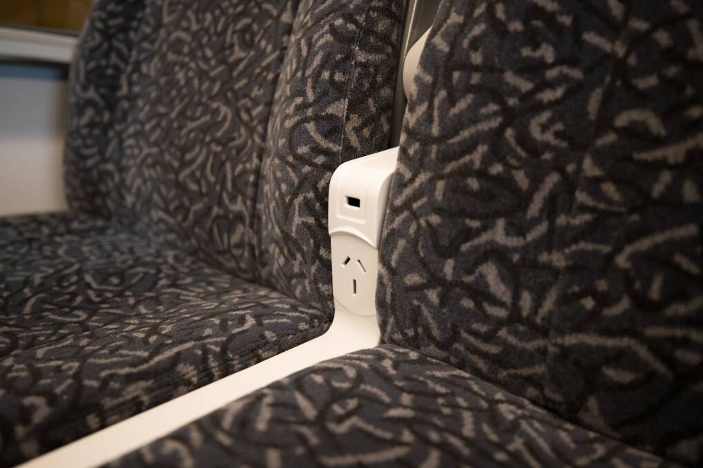 Plugged in: The mobile charging stations on the Transport for NSW model of the New Intercity Fleet located between two seats.