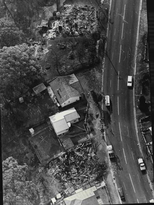 An aerial photo of Bulli Pass shows the random nature of fire with some houses gone while others remain standing.