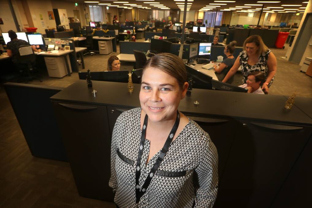 ﻿Scam stoppers: Emma Cuthbert at the Federal Government's Scams and Identity Theft Helpdesk, which is based out of a building in Dapto.Picture: Sylvia Liber
