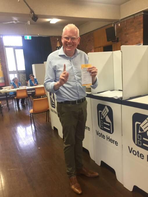 Winner: Kiama MP Gareth ward casting his vote in the election on Saturday - he has retained his seat with a likely increased margin. Picture: supplied