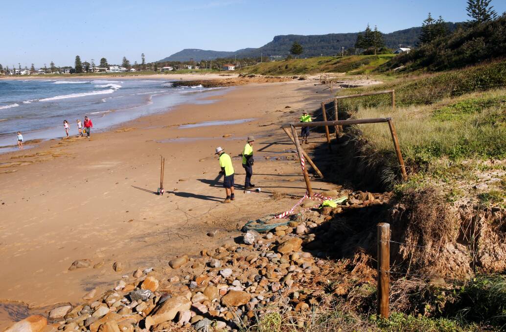 Wollongong City Council staff work to repair damage at Sandon Point caused by erosion in 2013. The local Aboriginal land council is worried further erosion is threatening a heritage site. Picture: Kirk Gilmour