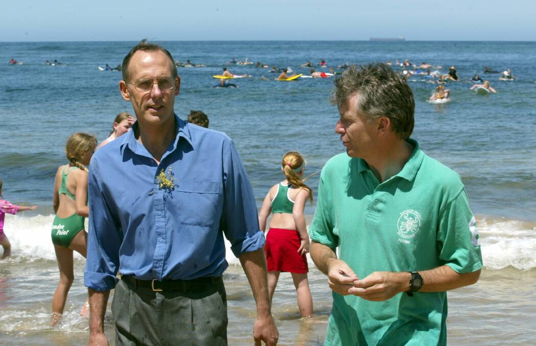 Michael Organ on Sandon Point Beach in October 2002 with Greens leader Bob Brown, whom he credits with raising the profile of the party. Picture: Hank van Stuivenberg