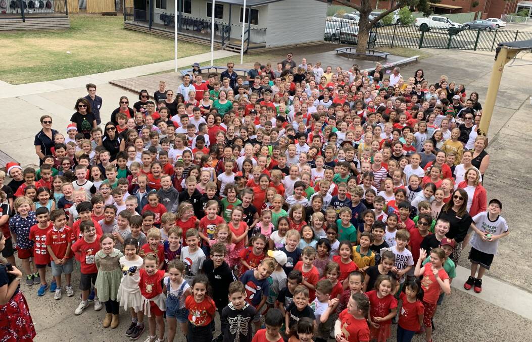 Good cause: Good Samaritan Primary School students dressed up in festive Christmas outfits and ready for the Bust the Dust raindance. Picture: supplied