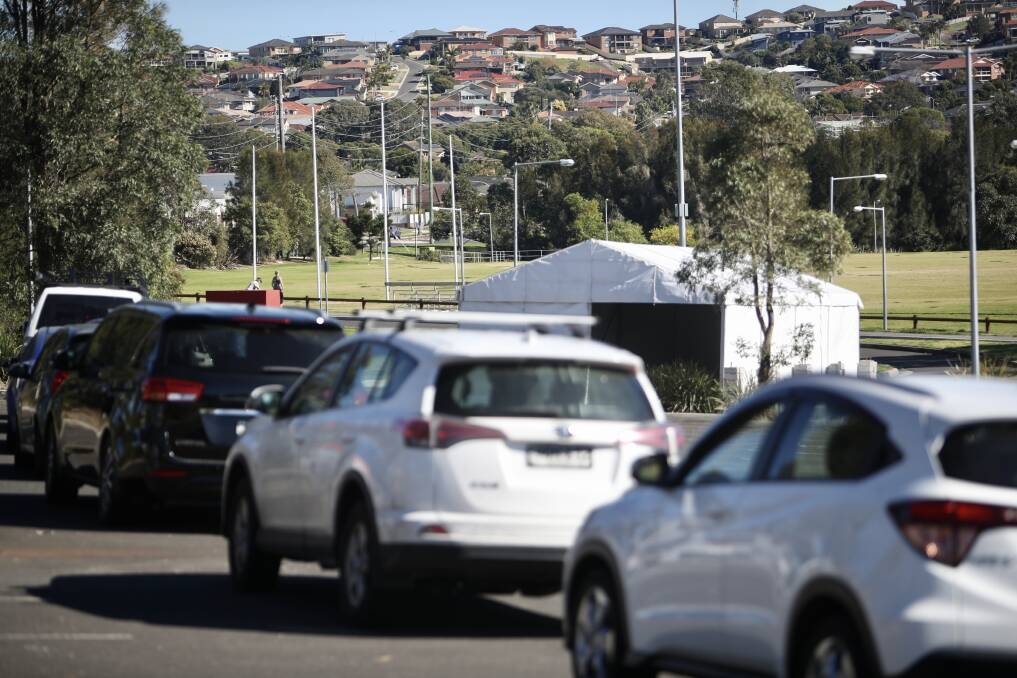 Testing: Cars queuing up at the pop-up COVID testing clinic at Myimbarr Oval car park in Shellharbour after the area's first case. Picture: Adam McLean