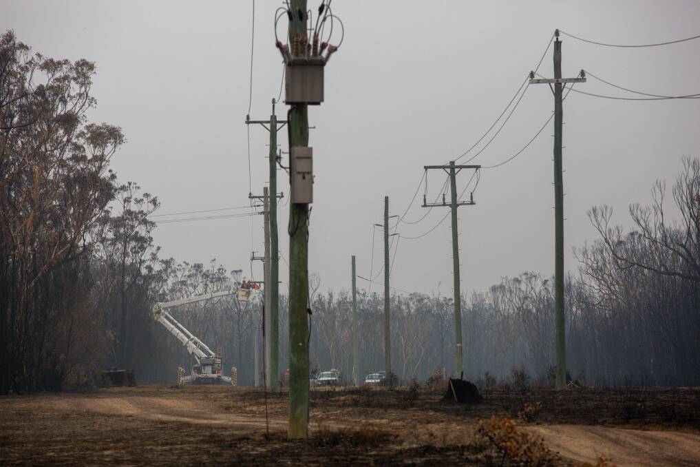 Pole problem: Endeavour Energy crews working on power lines in the South Coast - the provider is running out of power poles. Picture: supplied