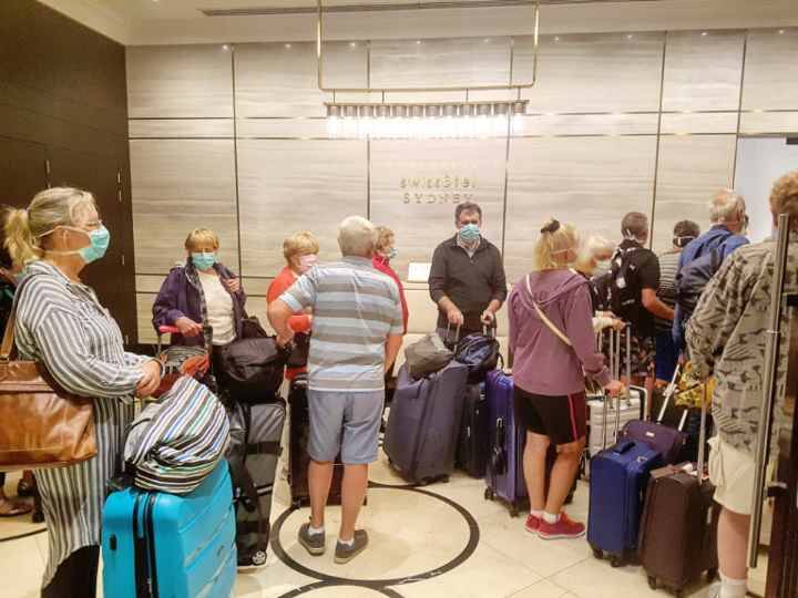 Passengers from the Norwegian Jewel wait in the foyer of the Swissotel in Sydney to get their rooms for the next two weeks. Picture: Tom Huntley