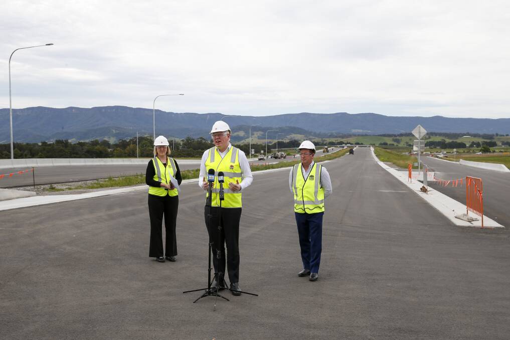 Good news: Transport for NSW Southern region director Sam Knight, Kiama MP Gareth Ward and Regional Transport and Roads Minister Paul Toole on the Albion Park Rail bypass, which will open more than a year ahead of schedule. Picture: Anna Warr