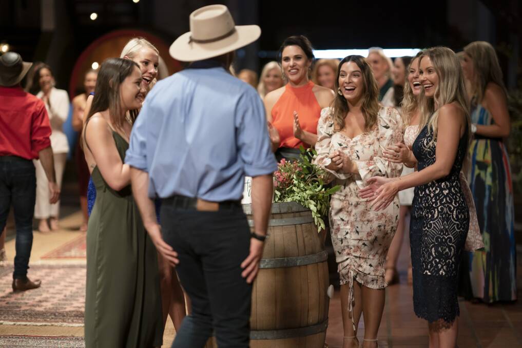 Hello: Nicole Warren (right) and the seven other women meet Farmer Alex. Picture: Channel 7
