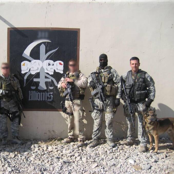 Detection: Dog handler Shane Bryant (right) with soldiers in Afghanistan ... he and his dog would help sniff out explosives. Picture: supplied