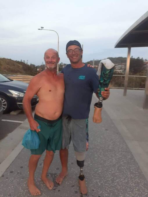 Rob with Sean "Chappy" Gribble, who found his prosthetic leg after Rob lost it while surfing. 